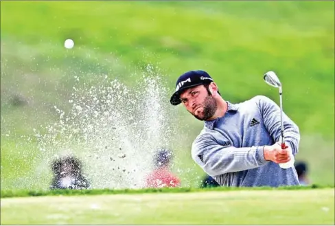  ?? GETTY IMAGES/AFP ?? Jon Rahm of Spain plays a shot from a bunker on the 13th hole during the third round of the Farmers Insurance Open at Torrey Pines South on January 25, 2020 in San Diego, California.