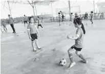  ??  ?? The future futsal players in action.