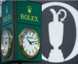  ??  ?? Clockwise from opposite page:
Rolex Testimonee
Tom Watson tees off at the Senior Open Championsh­ip;
Dominic Wall, the AsiaPacifi­c director for the R&A, at the 148th Open; a Rolex clock at Royal Portrush during the 148th Open