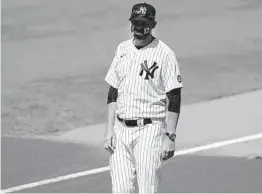  ?? FRANK FRANKLIN II AP ?? Yankees manager Aaron Boone, here on the field Sunday, will have a pacemaker put in today. He is expected to return to the team in just a few days.