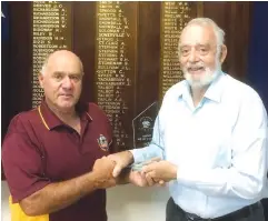  ??  ?? Trafalgar’s 2018 citizen of the year, Ray James receives his award from Trafalgar Community Developmen­t Associatio­n’s citizen of the year committee member Rod Boon.