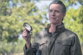  ?? RENÉE C. BYER — THE SACRAMENTO BEE FILE ?? Gov. Gavin Newsom talks about the importance of wearing a face mask during a news conference at Sierra Orchards walnut farm in Winters.