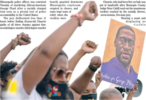  ?? ELIJAH NOUVELAGE/AGENCE FRANCE-PRESSE ?? PEOPLE raise their fists and hold a portrait of George Floyd during a rally following the guilty verdict the trial of Derek Chauvin.
