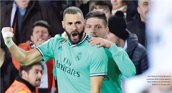  ?? (AFP) ?? Real Madrid's Karim Benzema celebrates after scoring against hosts Valencia at the Mestalla Stadium on Sunday