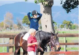  ?? ?? Luke West on Chloe, being led by Levin RDA volunteer Joan Sim.