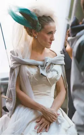  ?? DARLA KHAZEI/AP 2007 ?? Sarah Jessica Parker’s “Sex and The City” character, Carrie Bradshaw, is just one of the former brides restyling their wedding dresses to wear again.