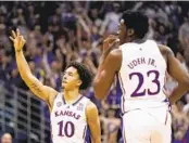  ?? CHARLIE RIEDEL AP ?? Kansas forward Jalen Wilson celebrates a 3-point basket during the first half against Kansas State.