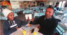  ?? ?? SBONGISENI Tshazi and Sandile Sayedwa enjoy a drink at Eziko Restaurant in Langa. | HANNES THIART