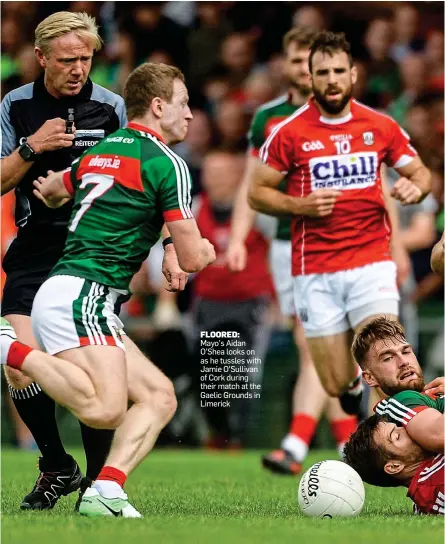  ??  ?? FLOORED: Mayo’s Aidan O’Shea looks on as he tussles with Jamie O’Sullivan of Cork during their match at the Gaelic Grounds in Limerick