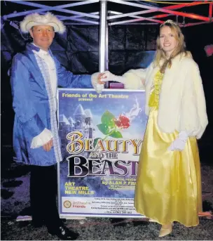  ??  ?? ●●Belle and the Prince from Beauty and the Beast at the New Mills Christmas lights switch-on