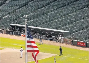  ?? Carolyn Cole
Los Angeles Times ?? AT EMPTY CAMDEN YARDS in Baltimore, the sounds of ball on bat were unusually crisp. But no one celebrated a fine catch or an inning-ending double play. “It’s weird,” said a coach for the visiting White Sox.