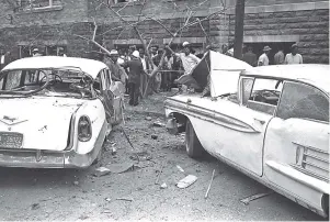  ?? ASSOCIATED PRESS PHOTOS ?? Above: Cars parked beside the 16th street Baptist Church, were blown four feet by an explosion during church services in Birmingham, Ala., on Sept. 15, 1963. Left: The bombing killed, from left, Denise McNair, 11; Carole Robertson, 14; Addie Mae Collins, 14; and Cynthia Wesley, 14