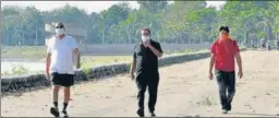  ?? KESHAV SINGH/HT ?? Residents out for a morning walk at Sukhna Lake in Chandigarh on Monday.