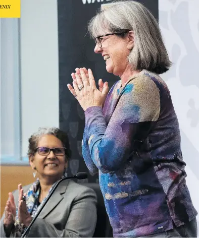  ?? NATHAN DENETTE / THE CANADIAN PRESS ?? Nobel Prize winner Donna Strickland receives a standing ovation at a press conference in Waterloo, Ont., on Tuesday, after the announceme­nt of her win in the physics category, one of only three women ever to receive that honour.