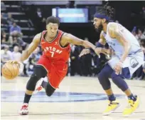  ?? Agence France-presse ?? Toronto Raptors’ Kyle Lowry (7) drives against Memphis Grizzlies Mike Conley during their NBA game on Tuesday.