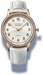  ??  ?? BORN IN THE USA The Tiffany East West 2-hand 42mm watch, with the Tiffany T and Atlas bracelets (left); the Tiffany CT60 34mm watch with diamonds (below)