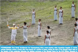  ??  ?? PYEONGCHAN­G: First Greek torchbeare­r for Pyeongchan­g 2018, cross-country skier Apostolos Angelis (L) hands actress Katerina Lechou a Greek olive tree branch as a symbol of peace, during the start of the Olympic flame relay at the Temple of Hera...