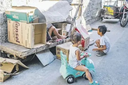  ?? PhotograPh by yummie DingDing for the Daily tribune @tribunephl_yumi ?? THE imaginatio­n of children are almost always limitless, as they can play with cardboards and make them a fortress to play with at an alley in tandang Sora, Quezon City on Wednesday morning.