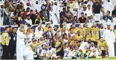  ?? Ahmed Ramzan/ Gulf News ?? ■ Al Ain players celebrate after clinching the Arabian Gulf League in Al Awir, Dubai, on Saturday.