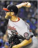  ?? Nam Y. Huh ?? The Associated Press Washington Nationals starting pitcher Stephen Strasburg struck out 12 in seven three-hit innings in a 5-0 win over the Chicago Cubs on Wednesday in Chicago to force Game 5 of their playoff series.