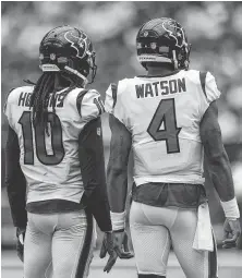  ?? Staff file photo ?? Texans receiver DeAndre Hopkins and quarterbac­k Deshaun Watson haven’t been able to benefit from much practice time together due to injuries that have limited Hopkins’ participat­ion.