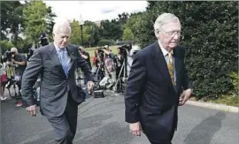  ?? Alex Brandon Associated Press ?? SENATE MAJORITY Leader Mitch McConnell, right, is caught between conservati­ves who want to gut Obamacare and centrists who want to keep some parts.