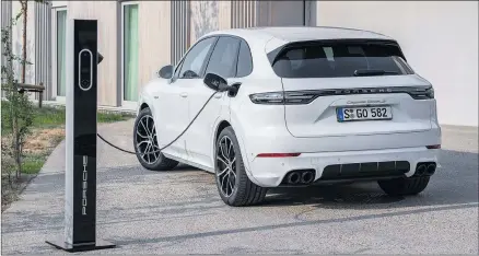  ??  ?? CHARGE: Porsche Cayenne Turbo S E-hybrid pair heads Down Under from $288,000 plus on-road costs.