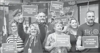  ??  ?? Union staff and employees are shown at a noontime rally at Veterans Affairs Canada’s office in Charlottet­own on Wednesday. In the midst of the Phoenix pay system scandal, the Public Service Alliance of Canada says the federal government is deliberate­ly delaying collective bargaining talks.