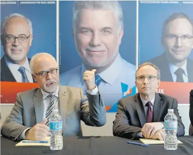  ?? PETER MCCABE/ THE GAZETTE ?? Liberal West Island candidates Carlos Leitao of Robert-Baldwin, left, and Martin Coiteux of Nelligan will be at Pierrefond­s-Roxboro train station from 7 a.m. to 8 a.m. Wednesday.