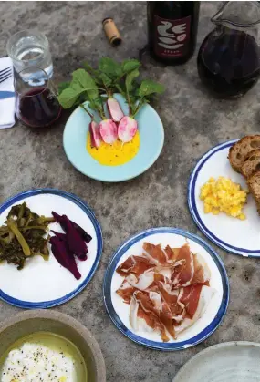  ??  ?? Clockwise from left: a selection of snacks at The Summertown Aristologi­st; chef André Ursini preps mushrooms at Villetta Porcini; friendly locals at CRFT Wines. Opposite, from top left: CRFT Wines’ shearingsh­ed-turned-cellar door; dessert is served at The Lane Vineyard.