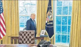  ?? AFP FILE ?? US President Donald Trump stands near a photo of his father Fred Trump in the White House.