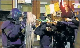 ?? ?? Face-off: Police in Dublin confront rioters furious at stabbings of schoolkids.
