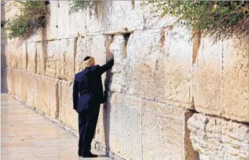  ?? RONEN ZVULUN/AFP ?? President Donald Trump visits the Western Wall, the first sitting U.S. president to do so.