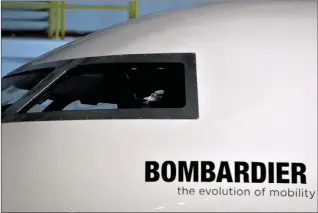  ?? NATHAN DENETTE/THE CANADIAN PRESS ?? A Bombardier Global 7000 aircraft mock up is shown in Toronto on Nov. 3, 2015. Bombardier now faces duties of almost 200 per cent to export its Cseries jets into the American market after the U.S. Department of Commerce tacked on another 80 per cent of...