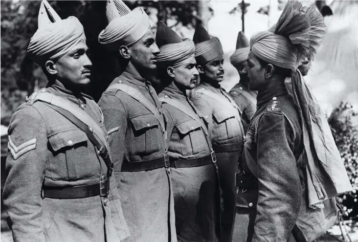  ?? Getty Images ?? Indians at war: Indian soldiers being inspected by their officer in England, some them just arrived from Dunkirk. The soldiers served with distinctio­n throughout the war