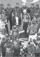  ?? ROB CARR/GETTY IMAGES ?? NFL referee Carl Cheffers does the coin toss before Super Bowl 57.