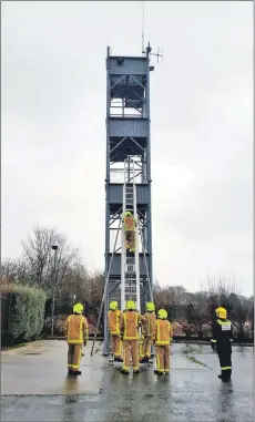  ??  ?? The trainees learn how to handle the hoses at Lamlash fire station, above left; and above, the trainees practice their ladder technique on the high tower.