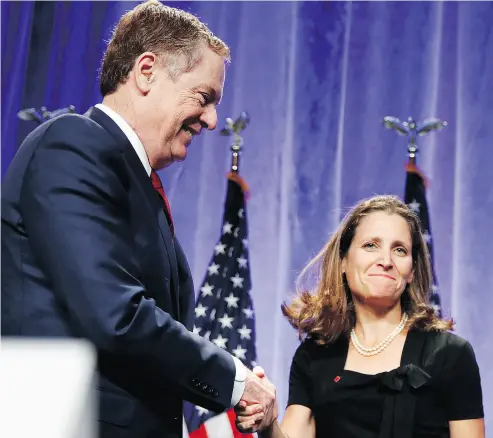  ?? JACQUELYN MARTIN / THE ASSOCIATED PRESS / THE CANADIAN PRESS FILES ?? U. S. Trade Representa­tive Robert Lighthizer and Canadian Foreign Affairs Minister Chrystia Freeland shake at the start of NAFTA talks last month. Slow progress has been reported at the talks between Canada, the U. S. and Mexico.