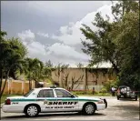  ?? MEGHAN MCCARTHY / DAILY NEWS ?? A Palm Beach County sheriff’s detective responds to Tuesday’s lightning strike in Lake Worth near 22nd Avenue and Pierce Drive.