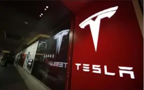  ?? Associated Press ?? Tesla is recalling nearly 363,000 vehicles with its “Full Self-Driving” system to fix problems with the way it behaves around intersecti­ons and following posted speed limits.