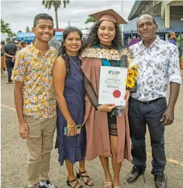  ?? Words: SHANIYAH KHAN ?? Graduate Norisha Naicker flanked her brother Ariyun Naicker and parents Najlin Nair and Keshwan Naicker after the University of the South Pacific graduation at the FMF Gymnasium, Laucala Bay on May 13, 2022.