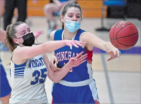  ?? SEAN D. ELLIOT/THE DAY Visit www.theday.com to view a photo gallery. ?? Coginchaug center Jessica Berens, right, denies Old Lyme center Emma McCulloch the ball off an inbounds play during Wednesday night’s season opener in Old Lyme. Coginchaug won the Shoreline Conference game 41-22.