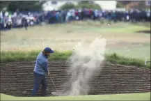  ?? AP photo ?? Tommy Fleetwood plays out of a bunker on the 16th hole Friday.