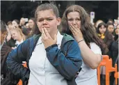  ?? VINCENT YU/AP ?? Students gather in March for a vigil to commemorat­e victims of a shooting in Christchur­ch, New Zealand.