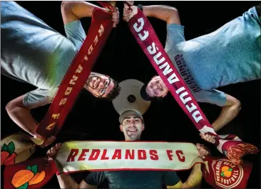  ?? TERRY PIERSON — STAFF PHOTOGRAPH­ER ?? Clockwise from left, Redlands FC Director of Operations Matthew Dodson-hamilton, co-founders Travis Spalding and Ryan Whiley display Redlands FC scarves, hats and T-shirts. The team will play at Dodge Stadium.