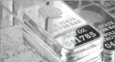  ??  ?? A SNEAK PEAK INSIDE SILVER VAULT BRICKS: Pictured left reveals the valuable .999 pure fine silver bars inside each State Silver Vault Brick. Pictured right are the State Silver Vault Bricks containing the only U.S. State Silver Bars known to exist with...