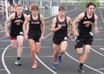  ??  ?? Layton Powell (second from right) and Troy Ferguson (second from left) came in third and fifth respective­ly in the 800-meter during the district meet.