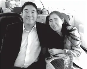  ?? AP/The David House Agency ?? Exonerated in the death of their daughter, American couple Matthew and Grace Huang take a flight Wednesday from Qatar to Los Angeles.