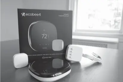  ?? Associated
Press file photo ?? ABOVE: An Ecobee smart thermostat, room sensor and connection components are shown Nov. 11 in Hastingson-Hudson, N.Y. Smart thermostat­s, which let consumers adjust their home temperatur­es remotely using any internet-connected device, are among the most popular smart home technologi­es,with the global smart thermostat­market surpassing $1 billion in 2017, according to Research andMarkets.