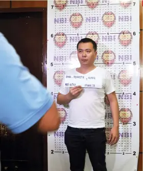  ?? SUNSTAR FOTO / AL PADILLA ?? ARRESTED. Cebu-based businessma­n Kenneth Dong undergoes the standard procedure of booking an caught person after he was arrested by the National Bureau of Investigat­ion, not for a drug-related offense, but for an alleged rape case.